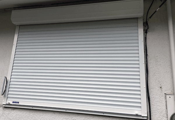 Outside View of House with Roll Shutters